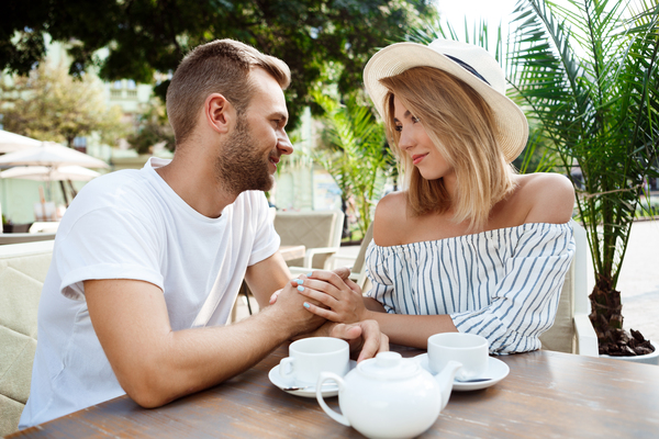 A couple having a relaxed conversation outdoors